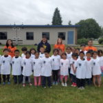 Summer Camp Children with their teachers posing outside