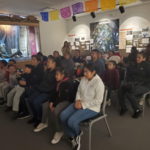 Attendees listening to presentation at the Museum