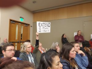 Sign reads: Extend 6 months, no $ Rent $