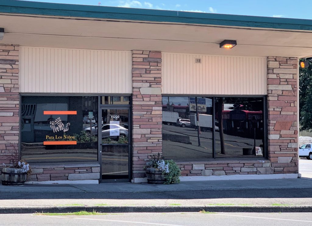 A beige building with stone columns. PLN's new offices in downtown Burien.